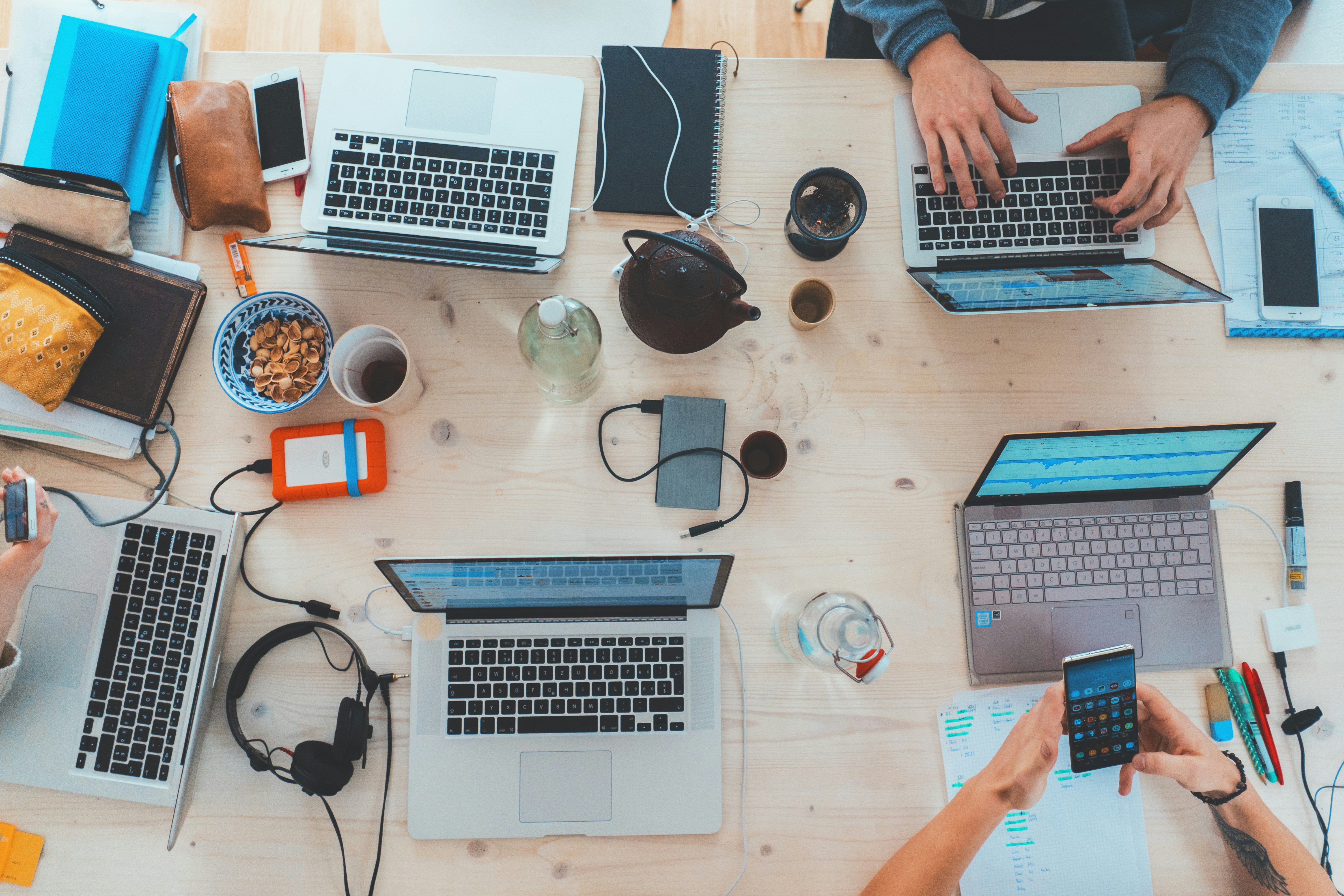 Group of people working on laptops